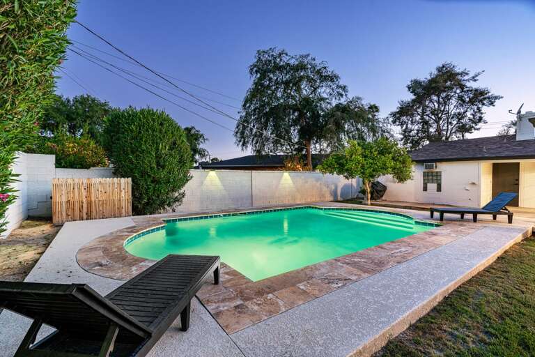 2 lounge chairs by the pool