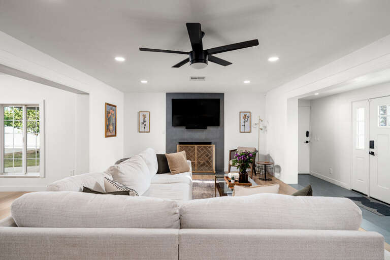 Living room with fireplace and TV