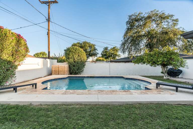 Private pool with exterior brick walls