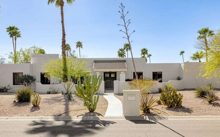 Front yard with desert landscaping on quiet street