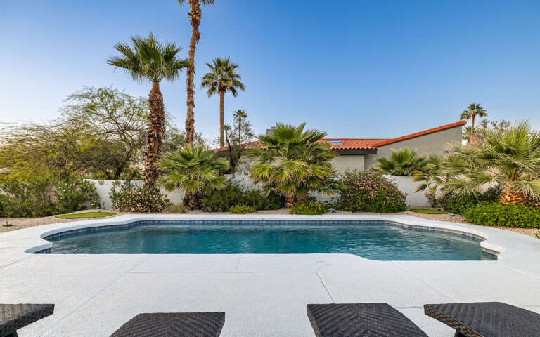 Sparkling pool with large cool deck.
