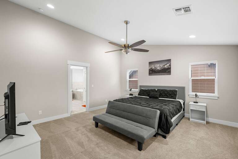 Primary Bedroom with en suite bath and TV