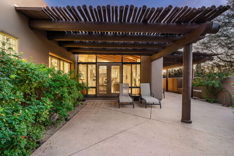 Private covered patio with lounge seating—perfect for morning coffee or relaxing evenings.