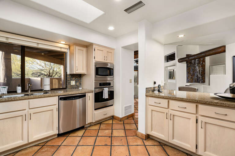 Spacious kitchen with granite counters, stainless appliances, and plenty of natural light.