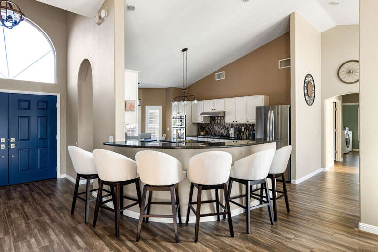 Bright, modern kitchen with plenty of seating for family meals and entertaining.