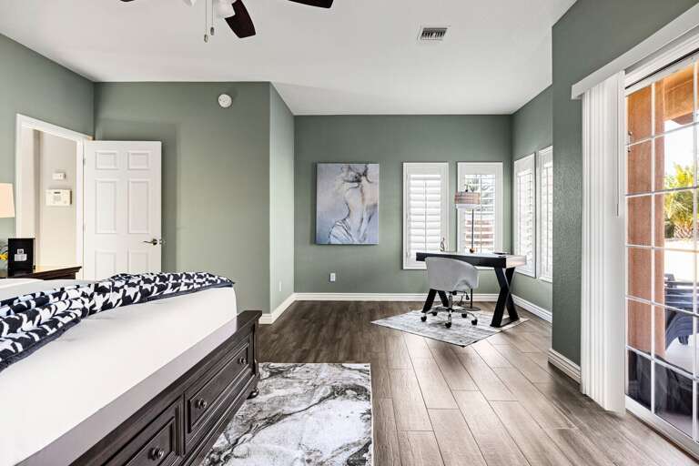 Expansive primary suite with dedicated workspace.