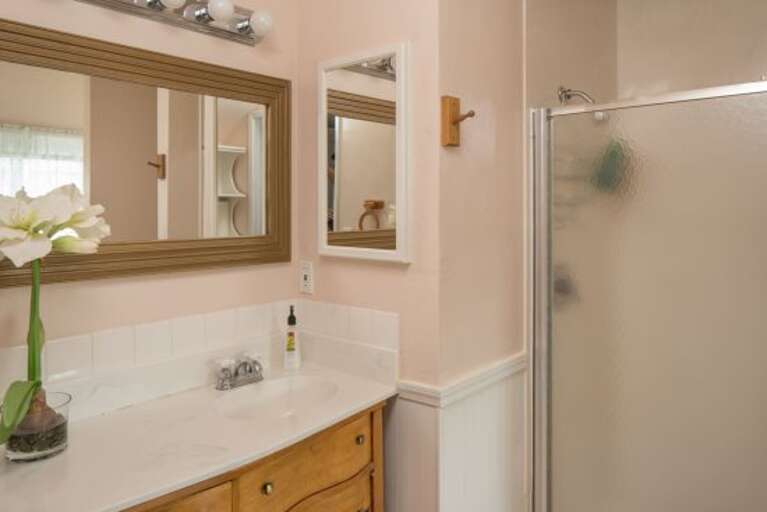 Fourth Bedroom: This elegant room includes a King-sized bed, faux-painted walls, and a bathroom with a claw-foot tub and separate walk-in shower for a spa-like feel.