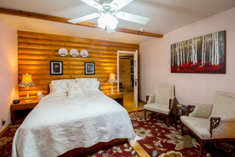 Welcome to the Heather Room at Quarter Horse Inn by PORTER. This cozy, cabin-style room in a historic private inn combines vintage charm of bygone era with modern comfort.