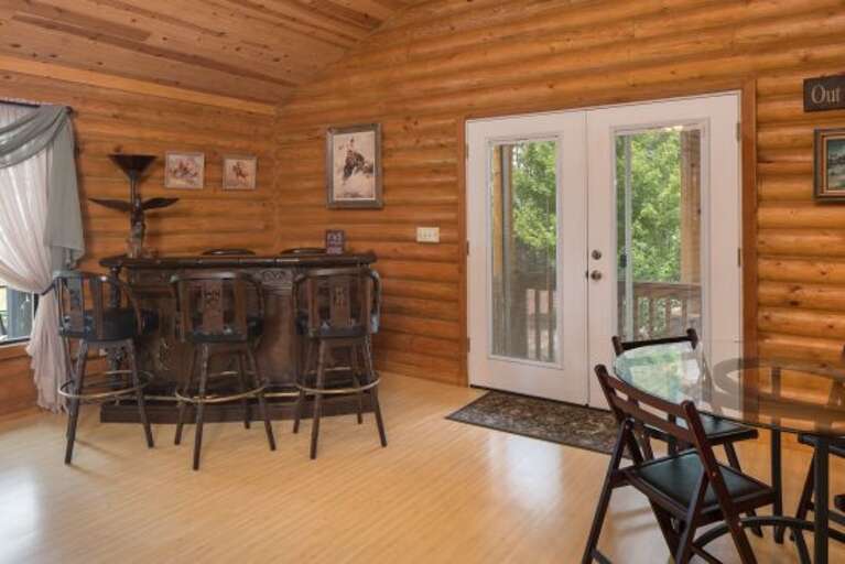 Large dining table with seating up to 12, Island seating for 4, Glass-top table in the Great Room for 4