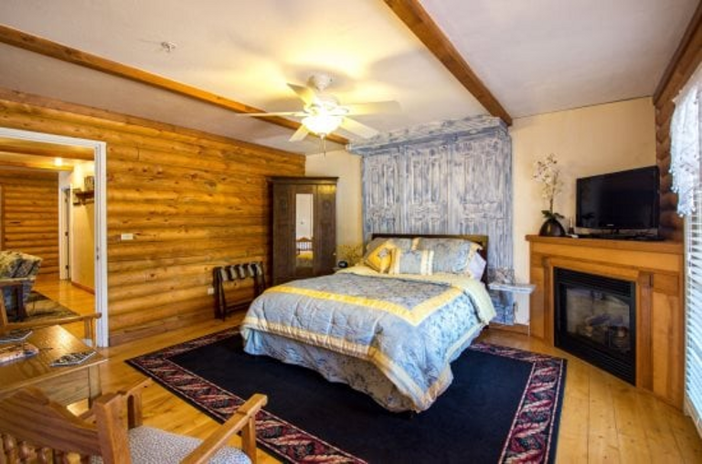 Relax in Comfort and Luxury: Sleep soundly on a cozy queen bed with pastel embroidery and plush pillows, then unwind in a private bath with jacuzzi for the ultimate relaxation.