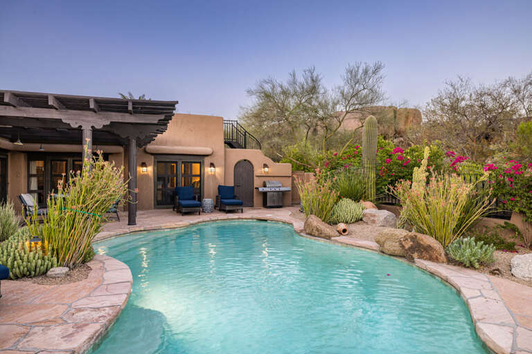 Cool off in the resort-style pool or relax on the surrounding patio while enjoying the beauty and privacy of the desert landscape.