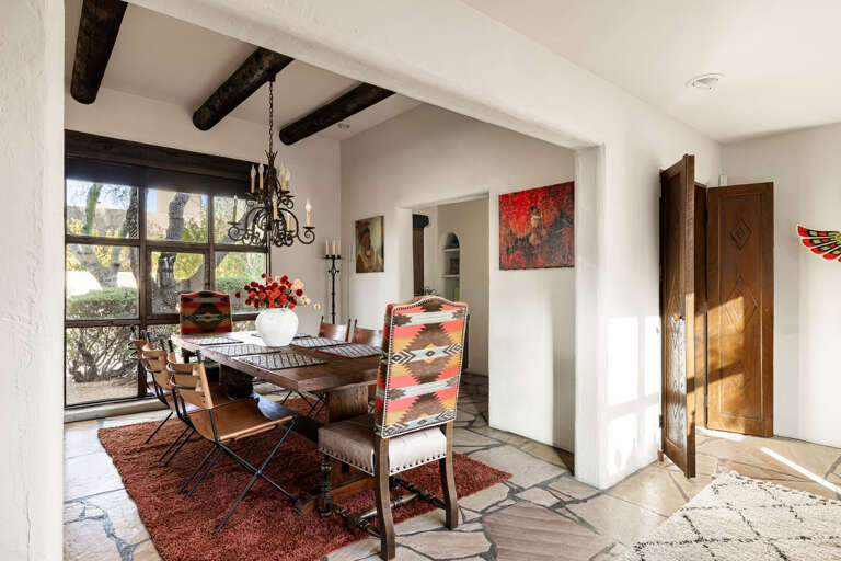 Enjoy memorable meals in the elegant dining room featuring seating for the whole group, natural light, and beautiful Southwestern décor.