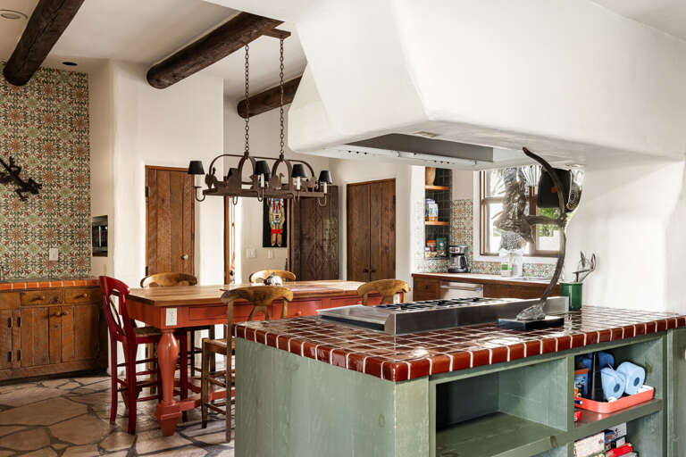 The expansive chef's kitchen features premium appliances, generous prep space, handcrafted finishes, and everything needed for memorable meals.