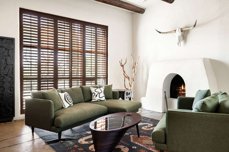 Gather around the charming kiva fireplace in this inviting lounge filled with natural light and classic Southwestern style.