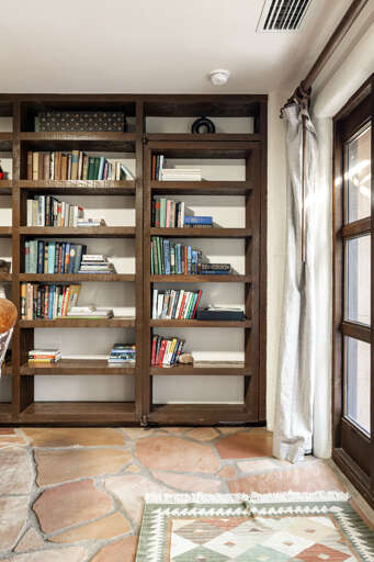 At first glance it's a beautiful built-in library—but there's more than meets the eye. Can you spot the hidden entrance?
