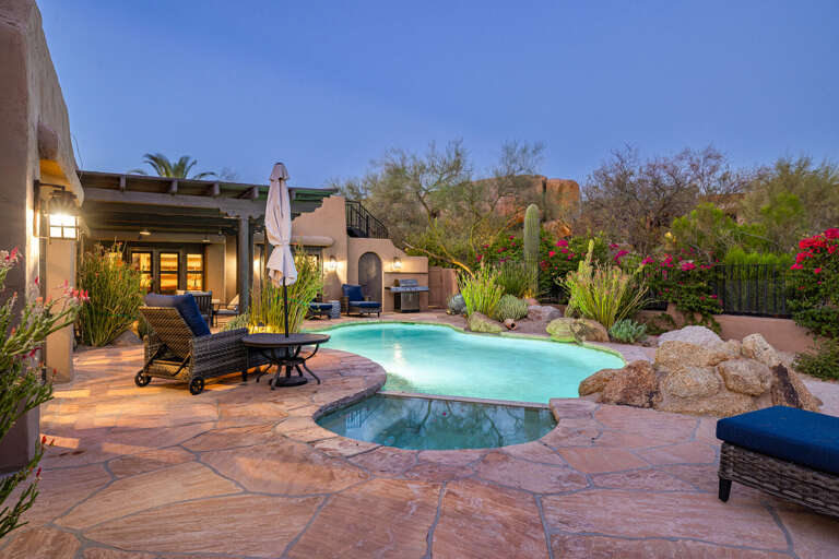 Relax in the private spa or take a refreshing swim in the resort-style pool, surrounded by lush desert landscaping and peaceful outdoor living.