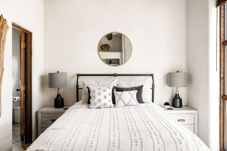 Relax in this thoughtfully designed guest room featuring comfortable bedding, Southwestern touches, and a quiet atmosphere for restful nights.