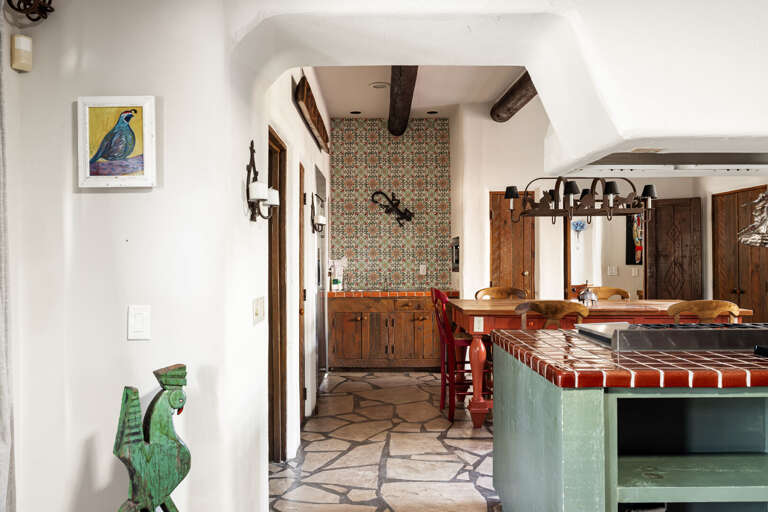 Step into the gourmet kitchen where handcrafted tile, rustic beams, and thoughtful design showcase the home's timeless character.