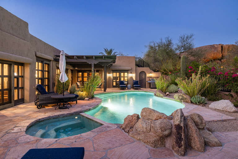 Unwind in the private spa or take a refreshing swim in the resort-style pool surrounded by beautiful desert landscaping.