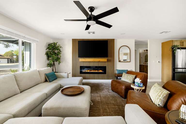 Bright and cozy living room with modern décor and comfortable seating for the whole group.