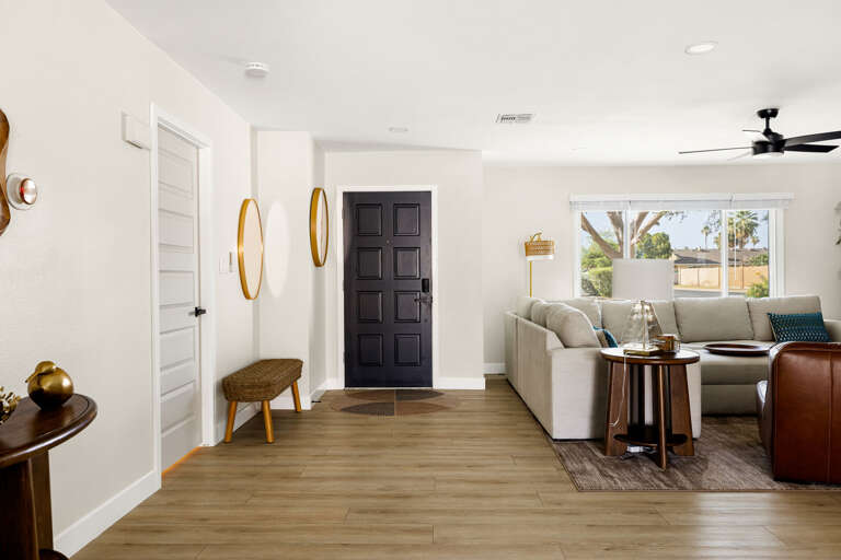 Bright and welcoming entryway with open living space and modern finishes throughout.