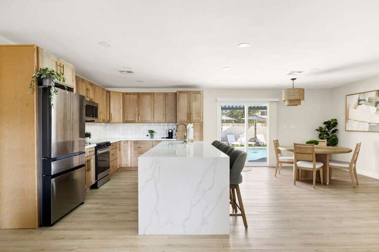 Open-concept kitchen and dining space designed for gathering, featuring contemporary finishes and natural light.
