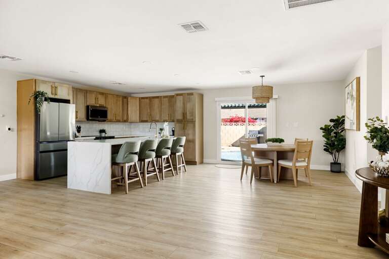 Spacious open-concept kitchen and dining area with modern finishes and plenty of room to gather.