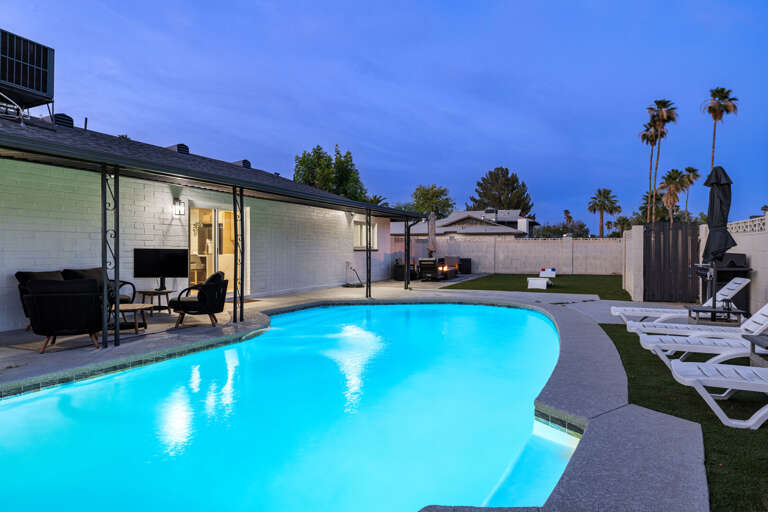 Stunning private pool, creating a serene resort-style atmosphere perfect for evening swims and outdoor relaxation.