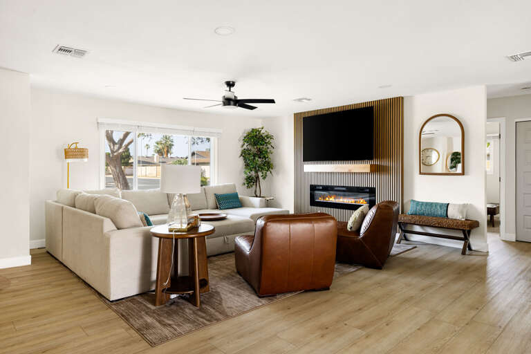 Stylish and spacious living room with comfortable seating, modern décor, and plenty of natural light.