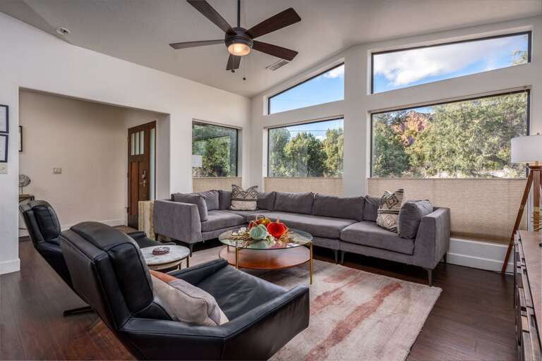 Gather beneath soaring ceilings and expansive windows, where natural light and red rock glimpses steal the show.
