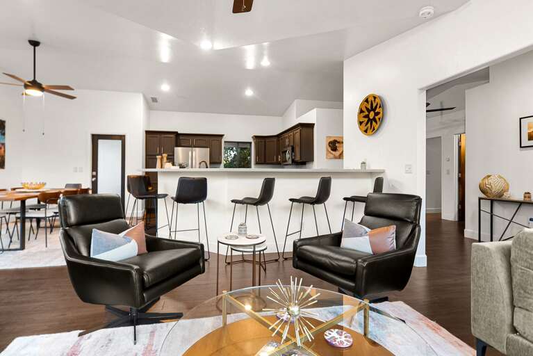 Living Area w/ Kitchen & Dining Area in Background