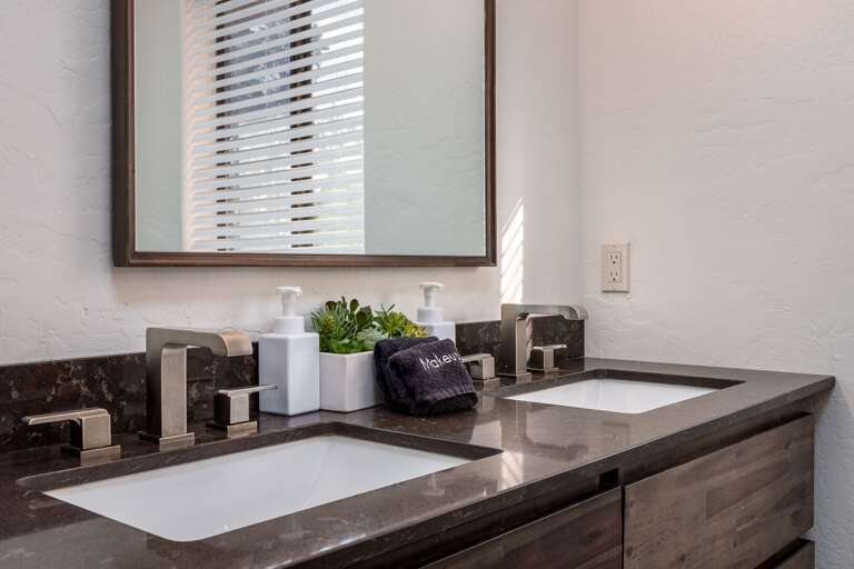 Start your day with ease at the dual-sink vanity, offering plenty of space to refresh and get ready.