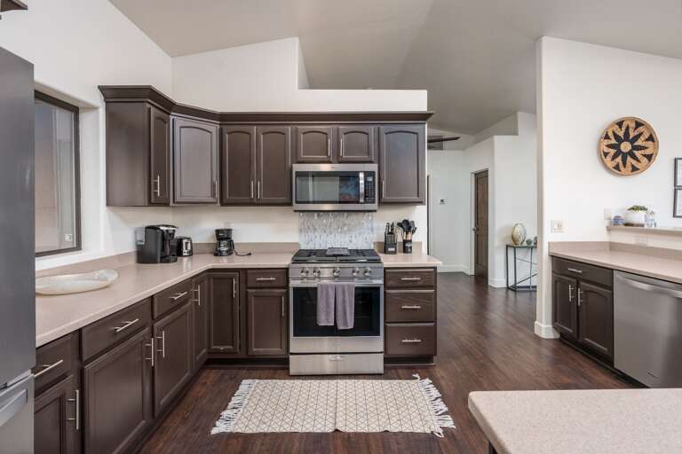 Whip up favorite meals in the fully equipped kitchen with ample counter space and modern appliances.