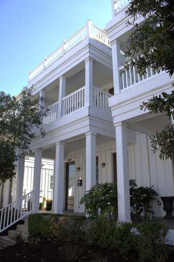 White-columned Vacation Rental With Double Decks White-columned Vacation Rental With Double Decks