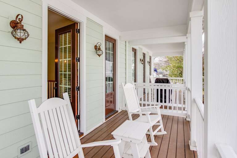 Second floor porch with rockers.