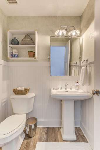 Downstairs powder room accessible from the kitchen Downstairs powder room accessible from the kitchen