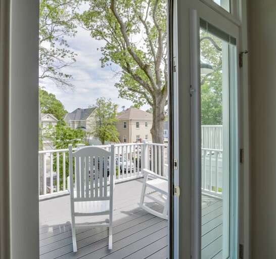 Master porch with rocking chairs overlooks the quaint courtyard in the rear of the house. Master porch with rocking chairs overlooks the quaint courtyard in the rear of the house.