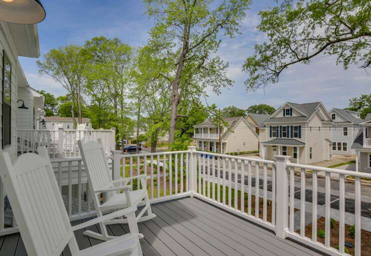 Master porch with rocking chairs overlooks the quaint courtyard in the rear of the house. Master porch with rocking chairs overlooks the quaint courtyard in the rear of the house.