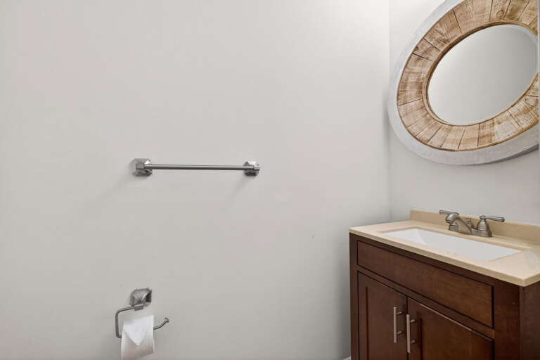 Just off the main living room and work-space, there is a half bathroom.