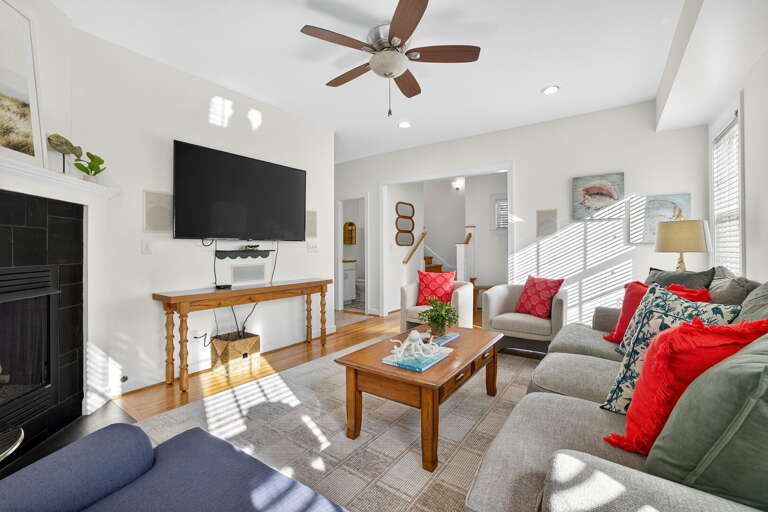 Bursting with natural light, this living room has been fully refreshed and redecorated to a casual, modern beach getaway spot perfect for a small group of friends or family, even for littles. Bursting with natural light, this living room has been fully refreshed and redecorated to a casual, modern beach getaway spot perfect for a small group of friends or family, even for littles.