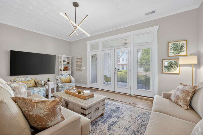 Large TV for streaming and entertainment pleasure. Comfortable seating and functional aspects throughout.