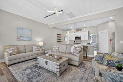 Living area and Open concept, fully stocked kitchen at the back