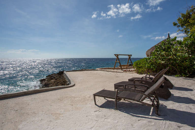 Sunbeds in the sand at Cracao vacation villa