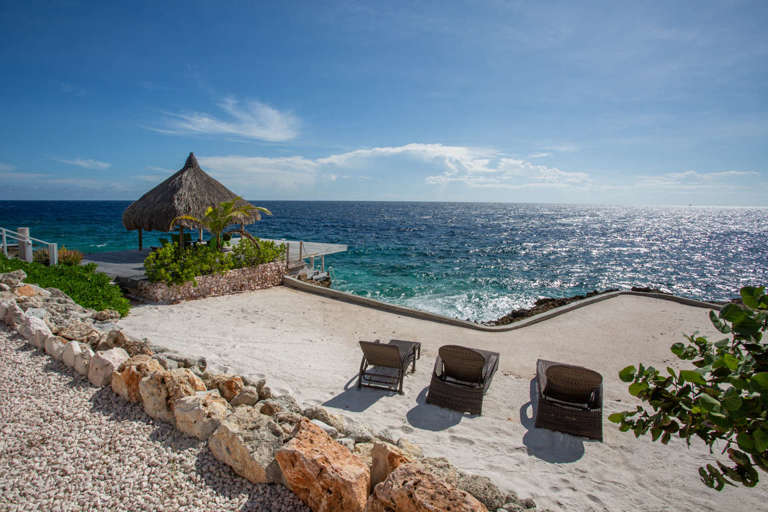 Sunbeds in the sand at Cracao vacation villa