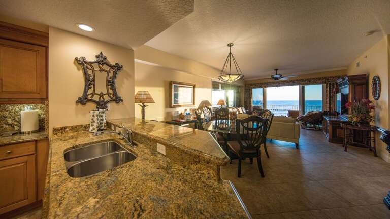 Kitchen has view of dining, living room, bar, and the ocean!