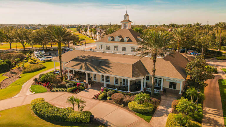 Aerial View Of A Sprawling Vacation Rental Surrounded By Palms