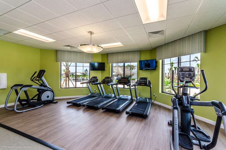 Sunlit Gym Space Sporting Sleek Treadmills And Elliptical Machines