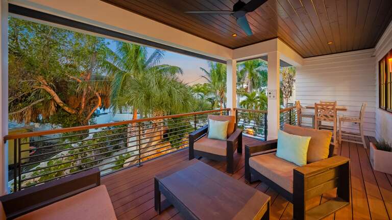 Rear Balcony with Dining and Soft Seating - Twilight