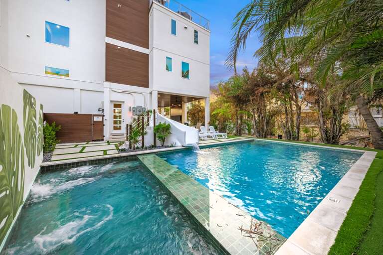 Daytime - Resort Style Pool & Spa - Waterslide - Tropical Landscaping