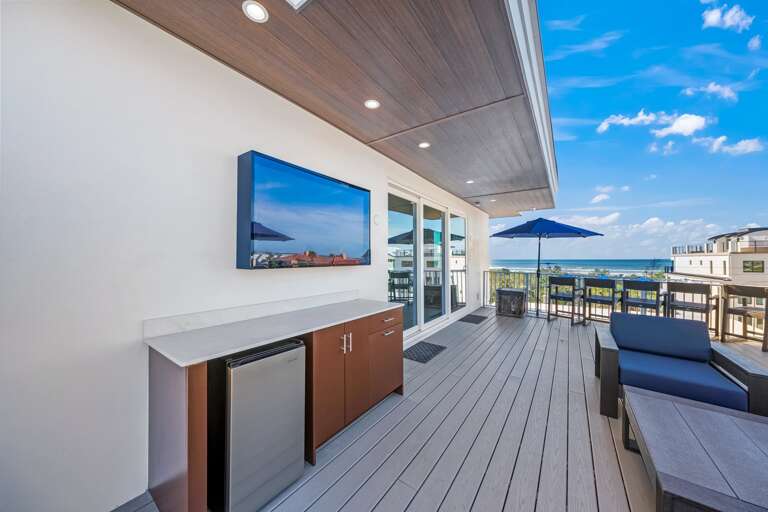 Daytime - Rooftop - Lounge Area - HD TV - Mini Fridge